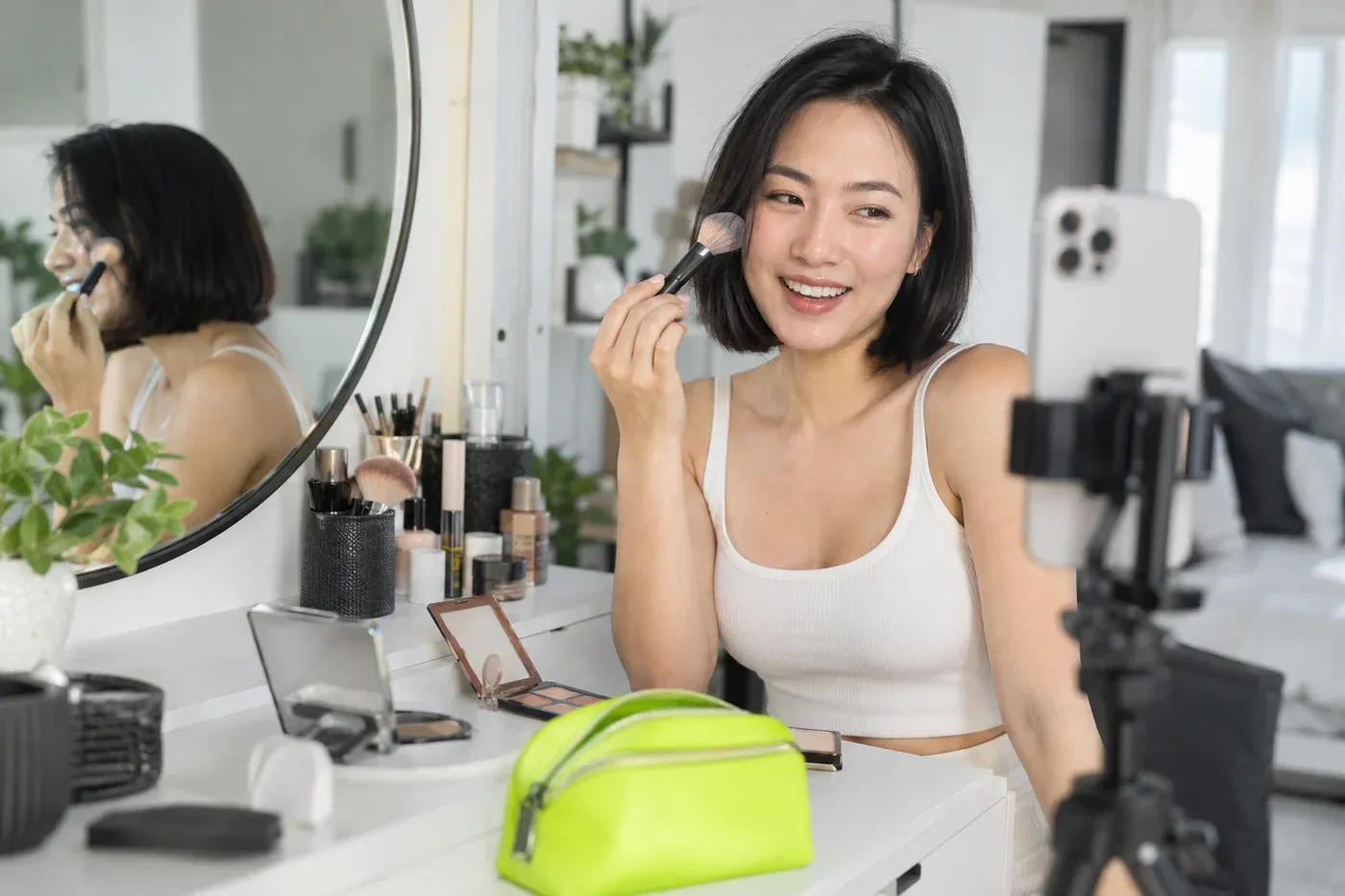 A beauty creator recording a tutorial for her community